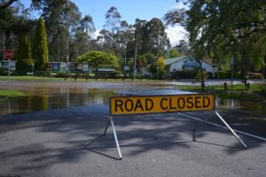 Flooded roads and several closures after heavy downpour