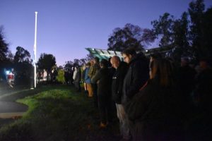 Sun rises over sombre Seville service